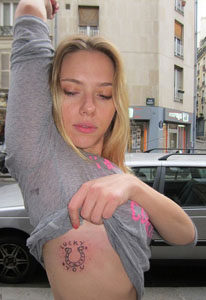 Actress Scarlett Johansson showing off her Lucky Horseshoe Tattoo